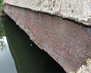 Uniform corrosion on a carbon steel beam section.